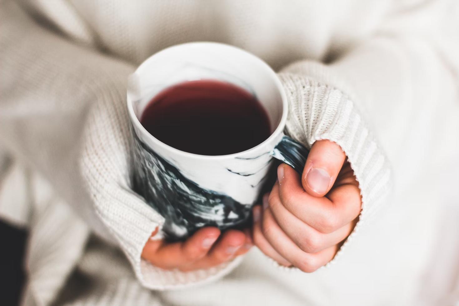 girl with cup of hibiscus tea