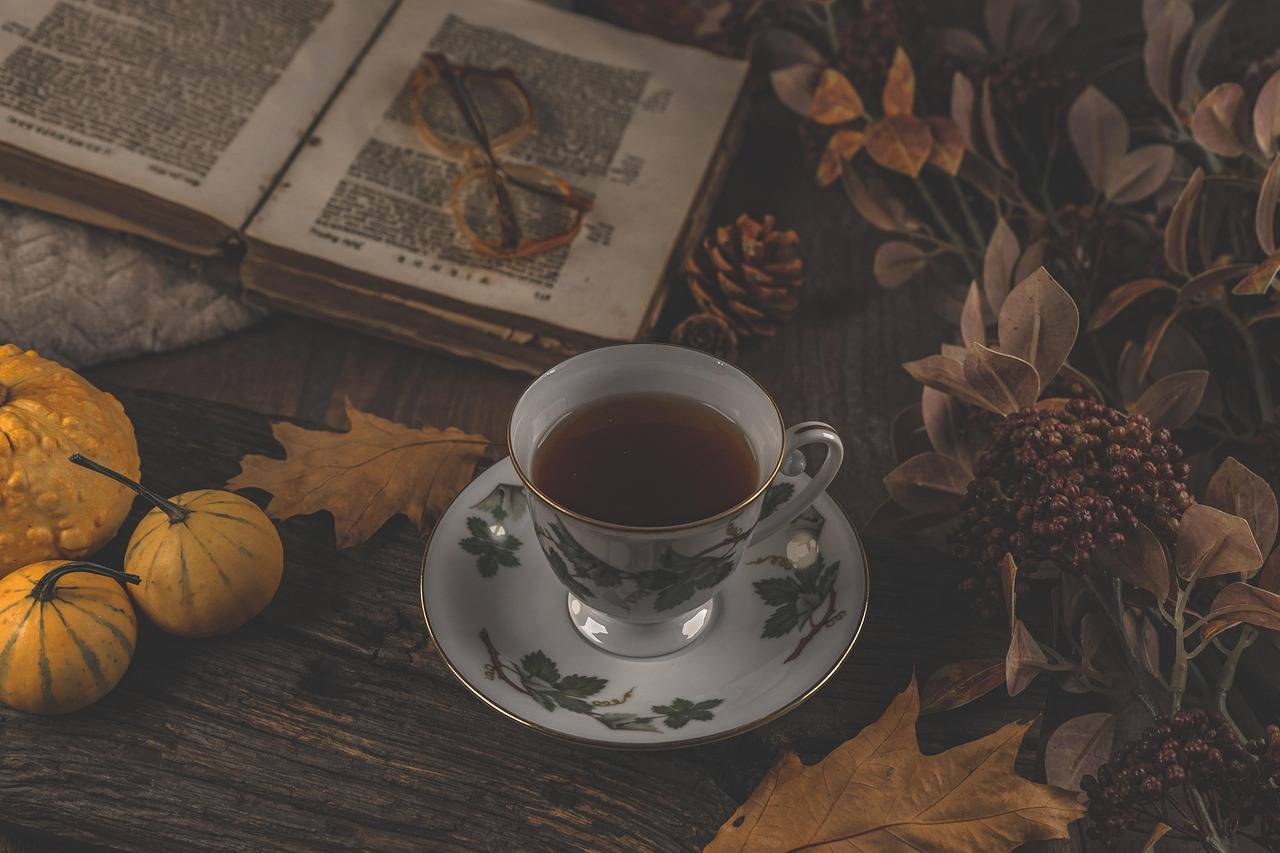 A teacup on a saucer on a wooden surface